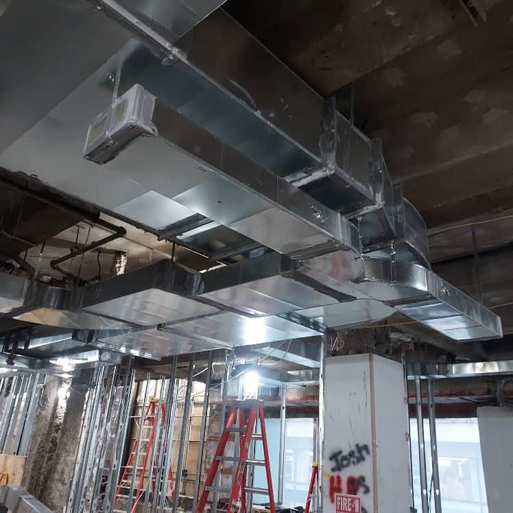 Rectangular sheet metal ductwork installed during a commercial renovation